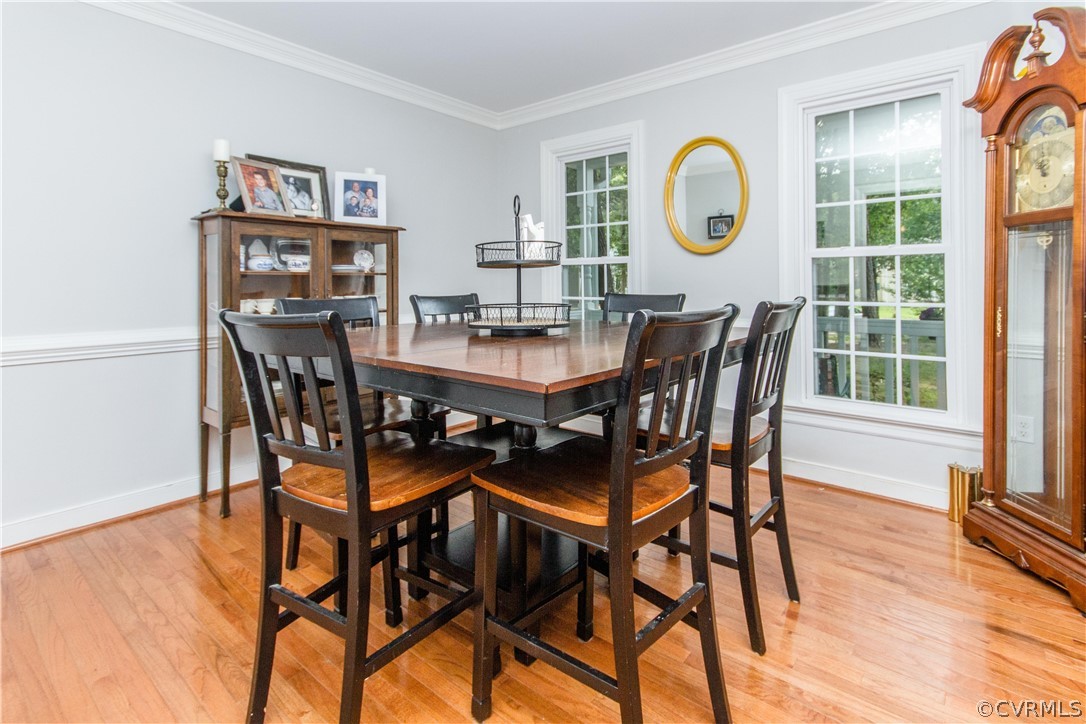 3902 Paces Ferry Road Chester, VA 23831 - Photo 9 of 31 a view of a dining room and livingroom with furniture wooden floor and a rug