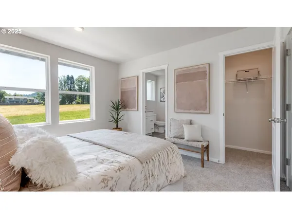 a living room with a bed and a window