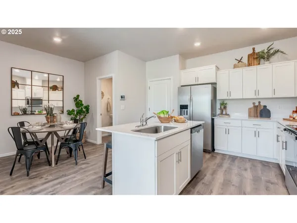 a kitchen with appliances and cabinets