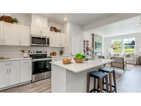 a kitchen with a table and chairs in it