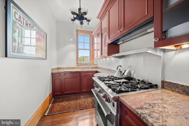 a kitchen with a stove and a sink