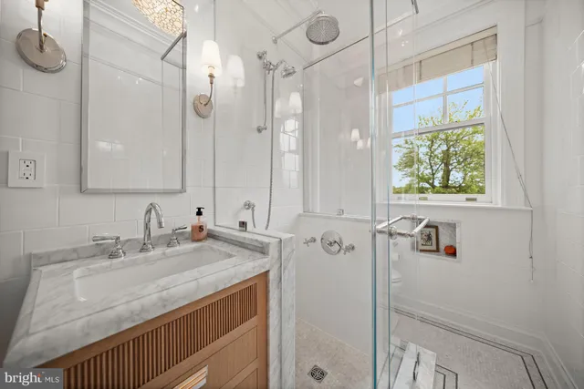 a bathroom with a sink and mirror