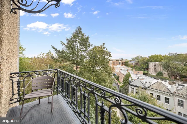 a view of balcony with furniture