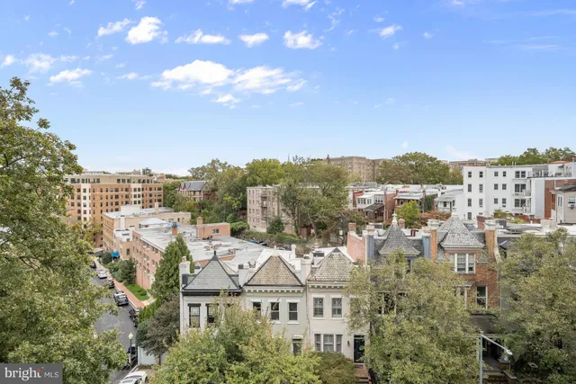 a view of city with tall buildings