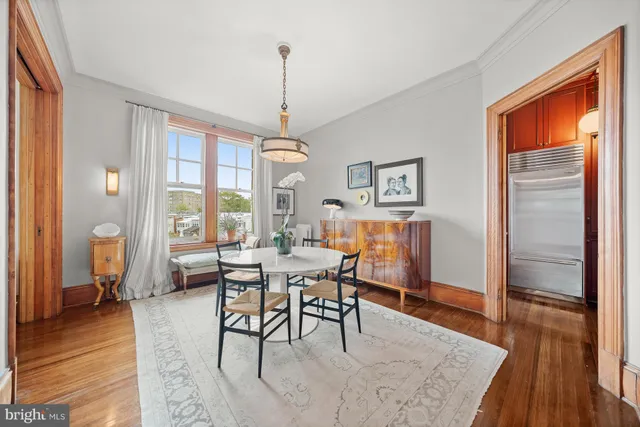 a view of a dining room with furniture window and wooden floor