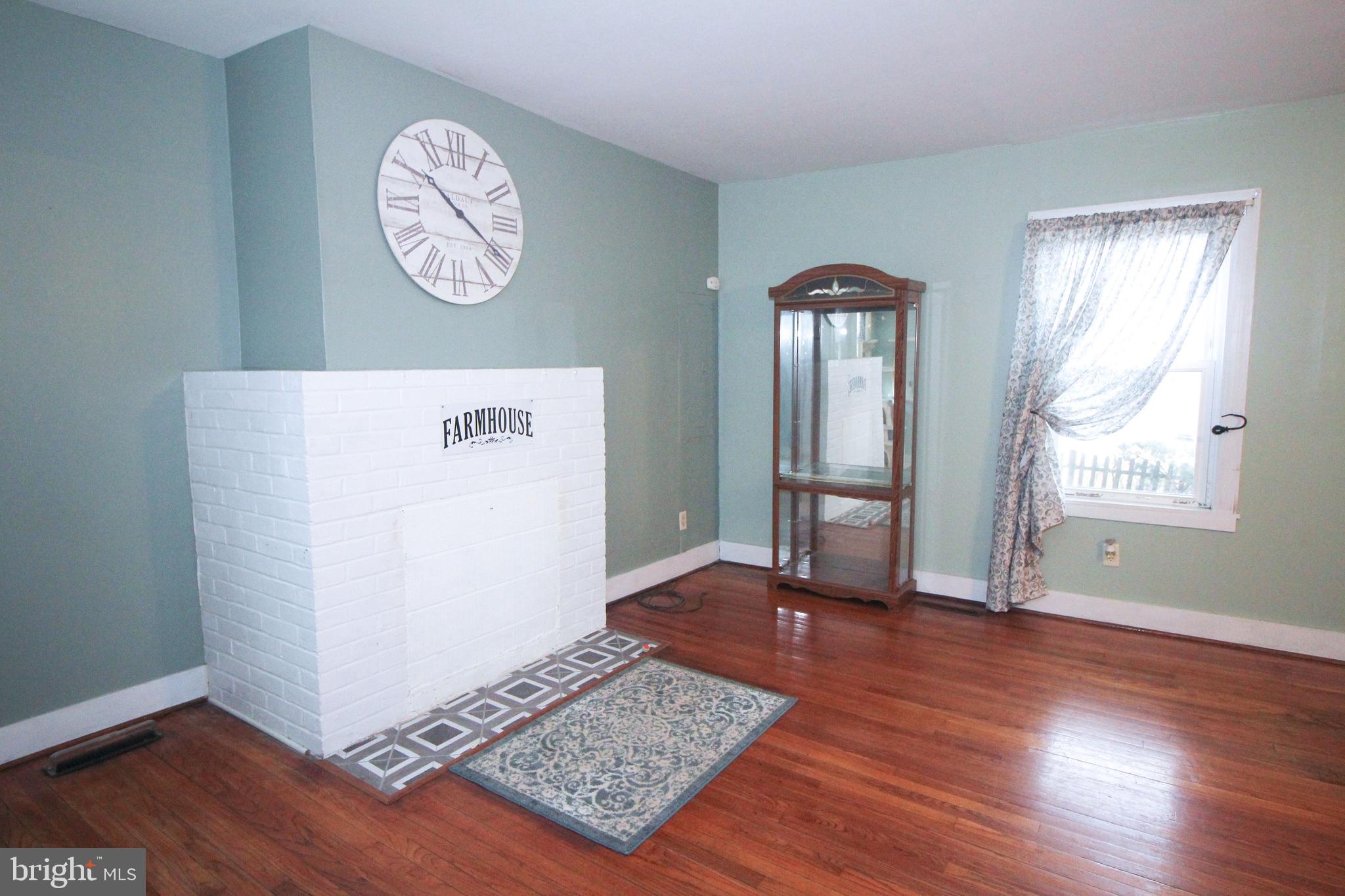 160 Funk Road Port Deposit, MD 21904 - Photo 18 of 51 a view of an empty room with wooden floor and a window