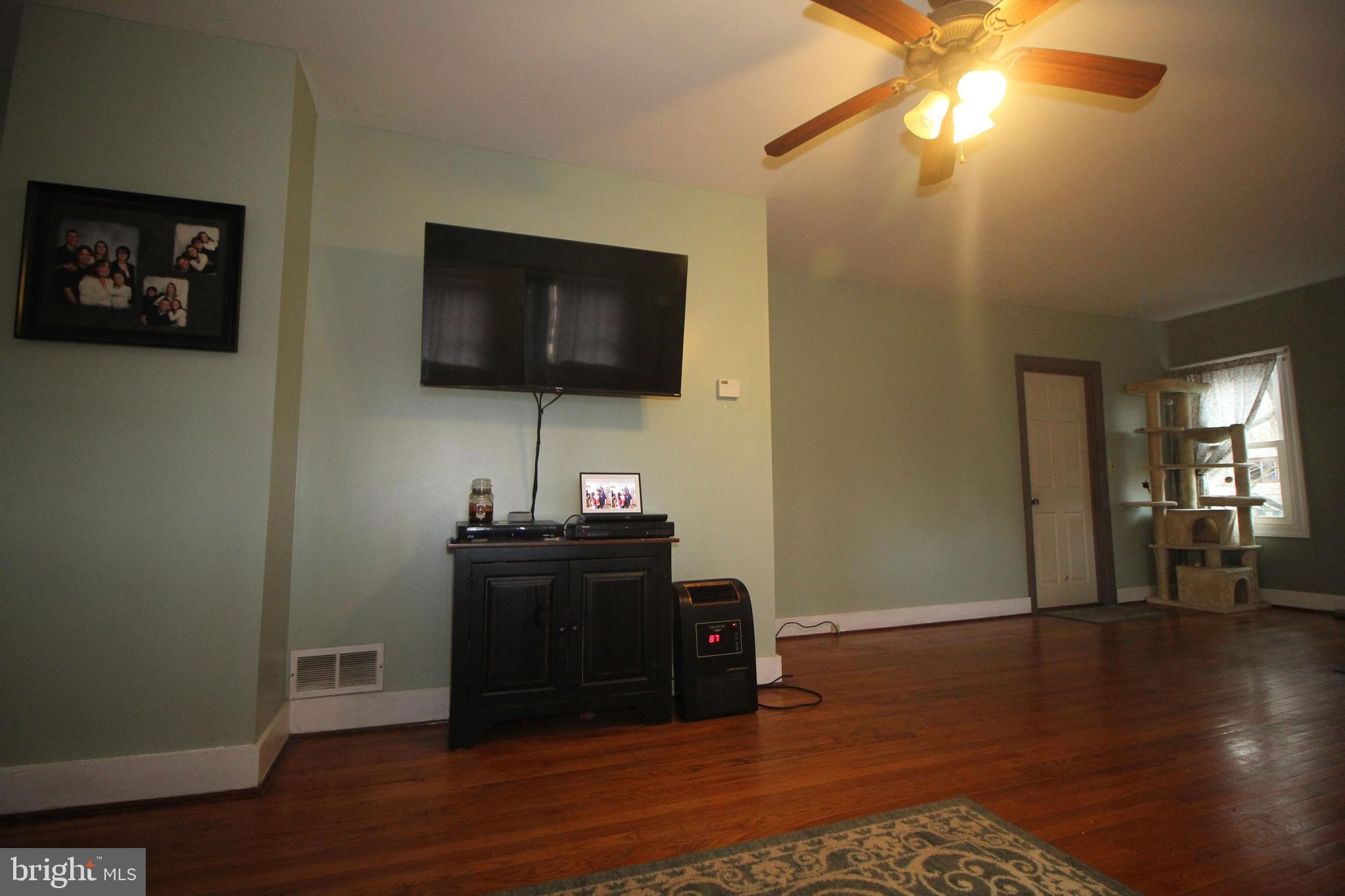 160 Funk Road Port Deposit, MD 21904 - Photo 21 of 51 a living room with furniture and a flat screen tv