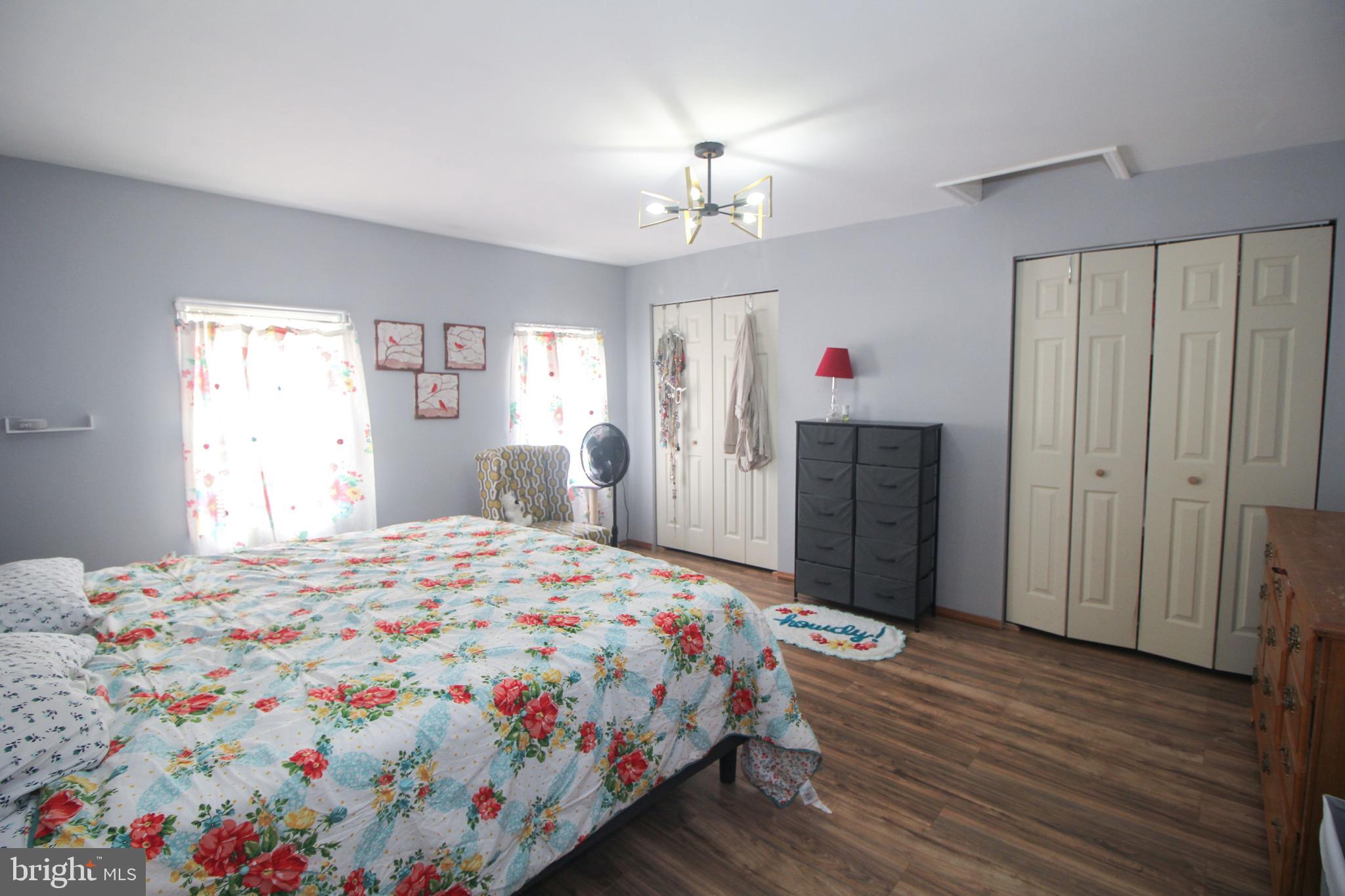 160 Funk Road Port Deposit, MD 21904 - Photo 31 of 51 a bedroom with a bed chandelier and a window