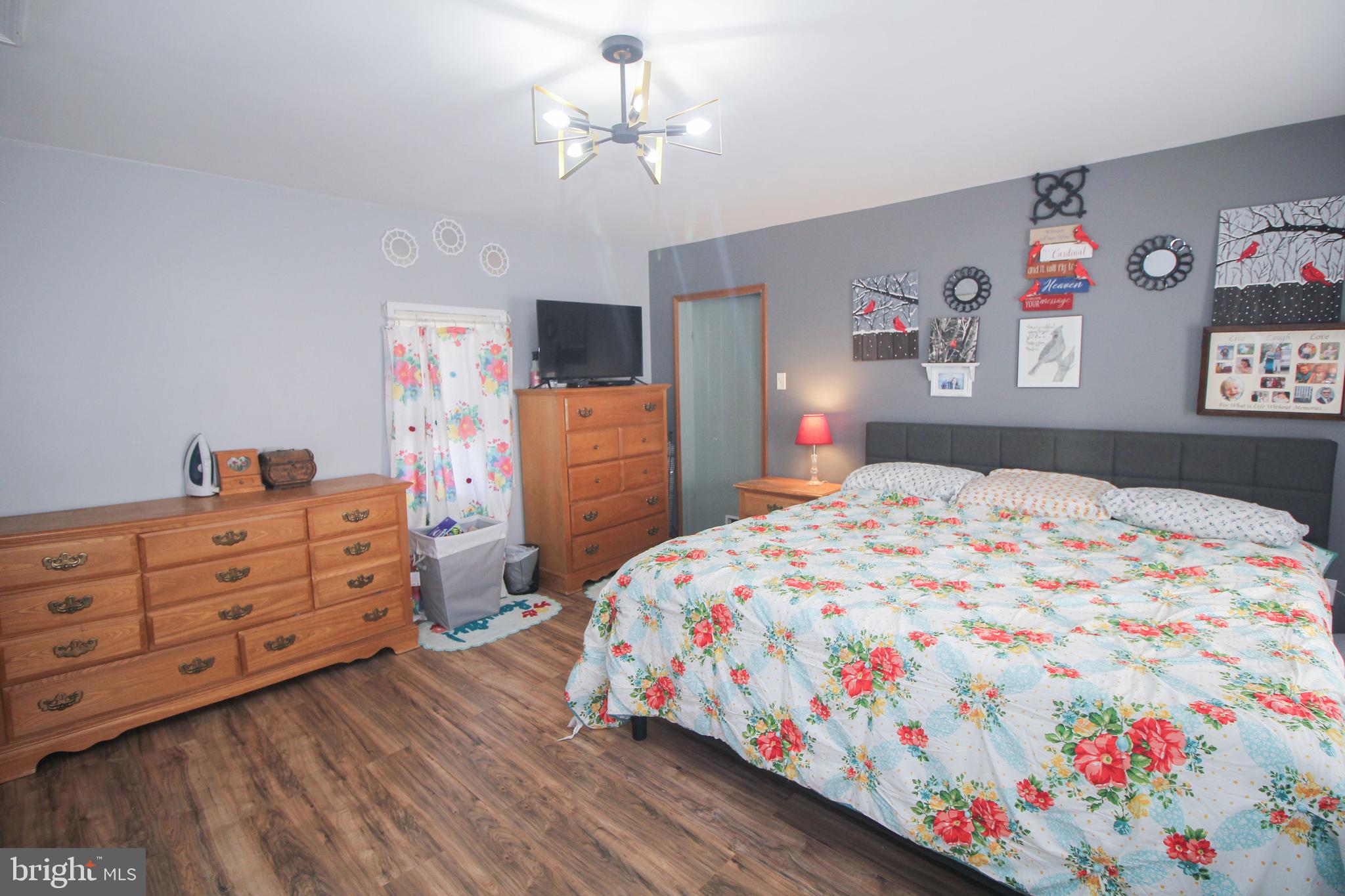 160 Funk Road Port Deposit, MD 21904 - Photo 32 of 51 a bedroom that has a bed and a chandelier