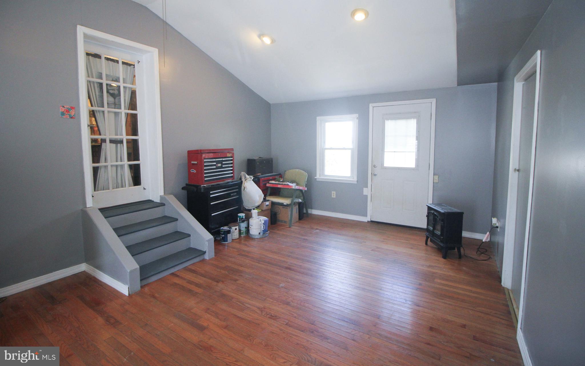 160 Funk Road Port Deposit, MD 21904 - Photo 40 of 51 a view of an empty room with furniture wooden floor and windows