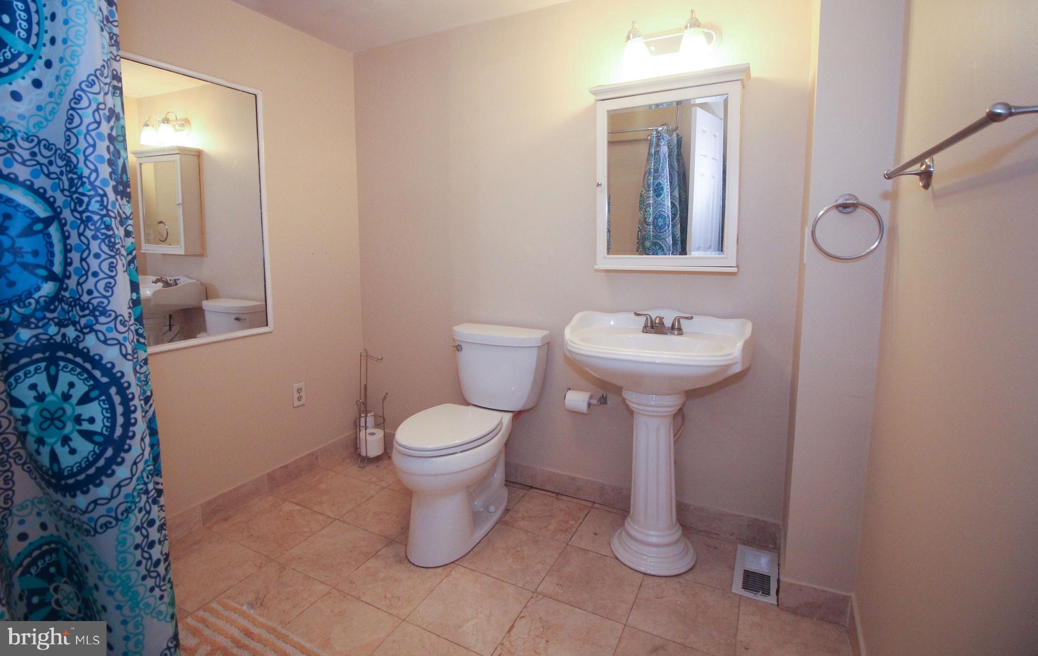 160 Funk Road Port Deposit, MD 21904 - Photo 42 of 51 a bathroom with a toilet sink and mirror