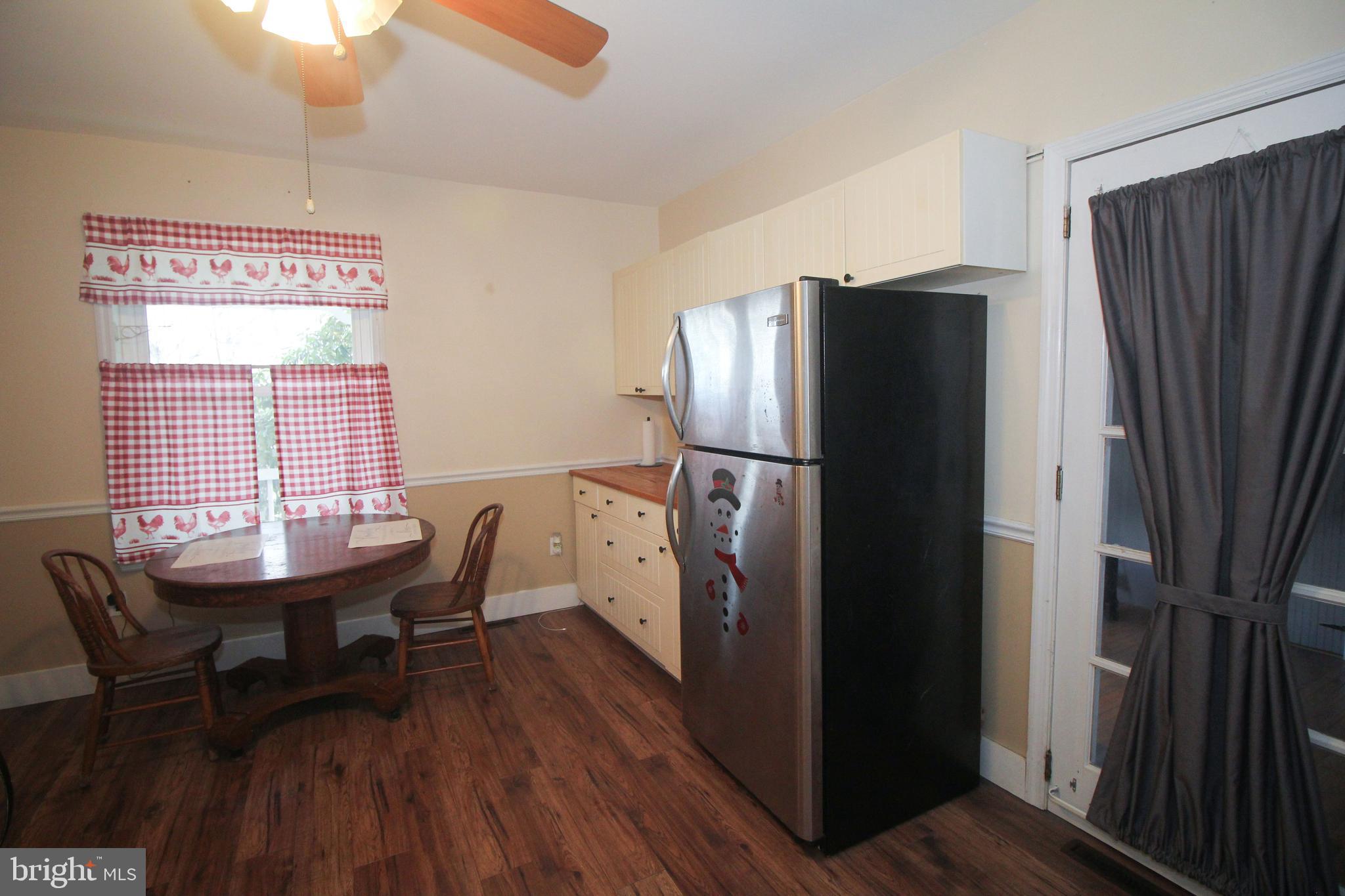 160 Funk Road Port Deposit, MD 21904 - Photo 46 of 51 a kitchen with stainless steel appliances a refrigerator a table and chairs
