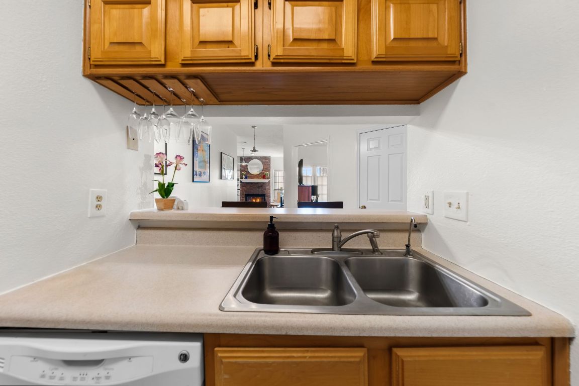 3001 Cedar Street, Unit 310 Austin, TX 78705 - Photo 12 of 27 a kitchen with stainless steel appliances a sink and a window