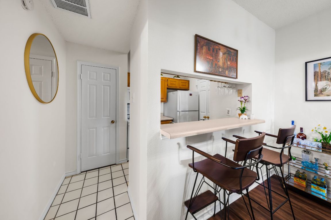 3001 Cedar Street, Unit 310 Austin, TX 78705 - Photo 9 of 27 a dining room with furniture and window