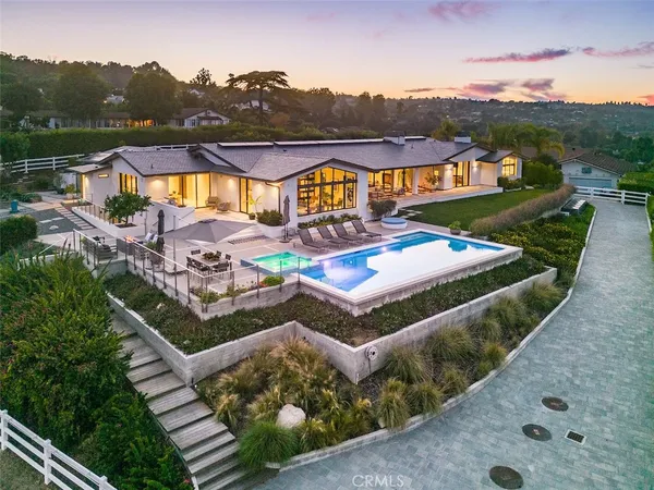 an aerial view of a house with a ocean view