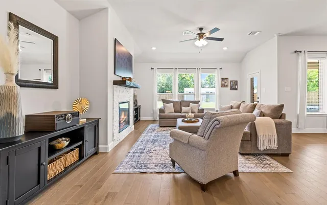 a living room with furniture and a flat screen tv
