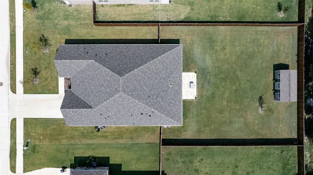 an aerial view of a house with a lake view