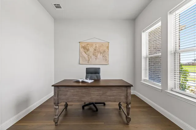 a workspace with furniture and window