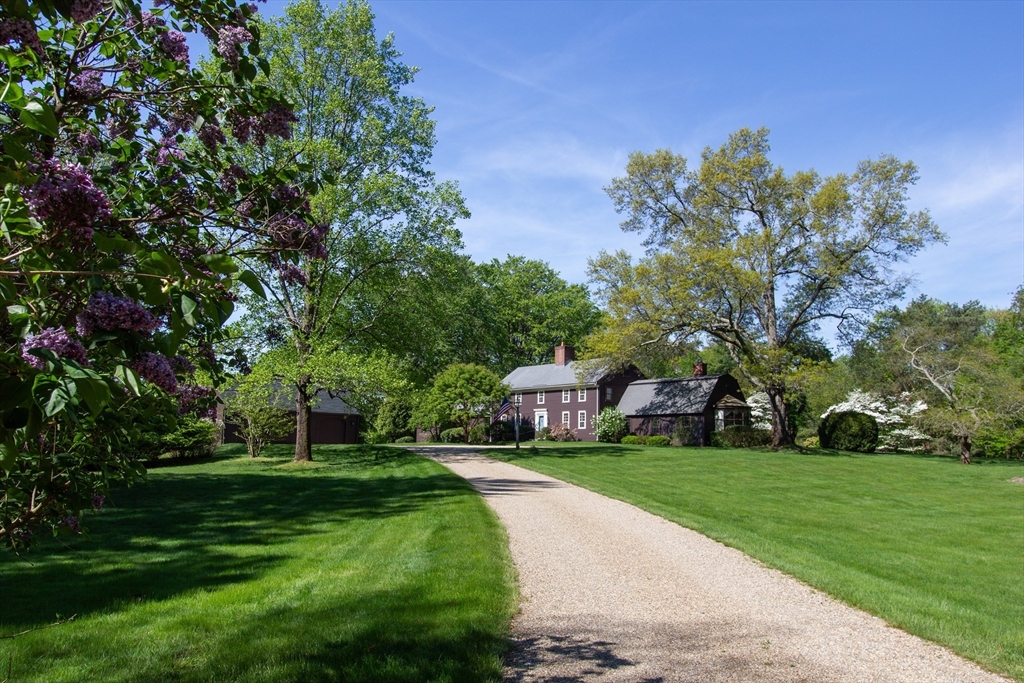 a view of yard with swimming pool and green space