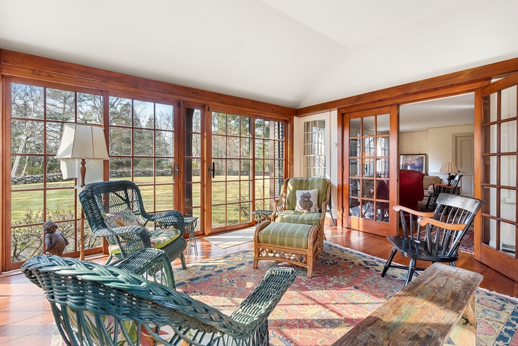 34 Miles River Road Hamilton, MA 01982 - Photo 15 of 42 a living room filled with furniture and a floor to ceiling window