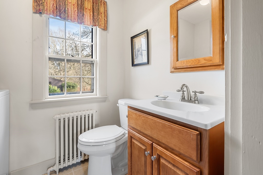 34 Miles River Road Hamilton, MA 01982 - Photo 18 of 42 a bathroom with a sink a toilet and a window