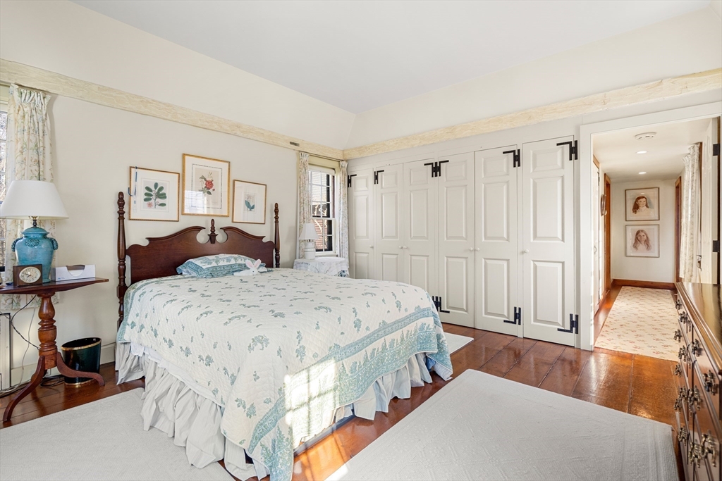 34 Miles River Road Hamilton, MA 01982 - Photo 22 of 42 a spacious bedroom with a bed and a couch