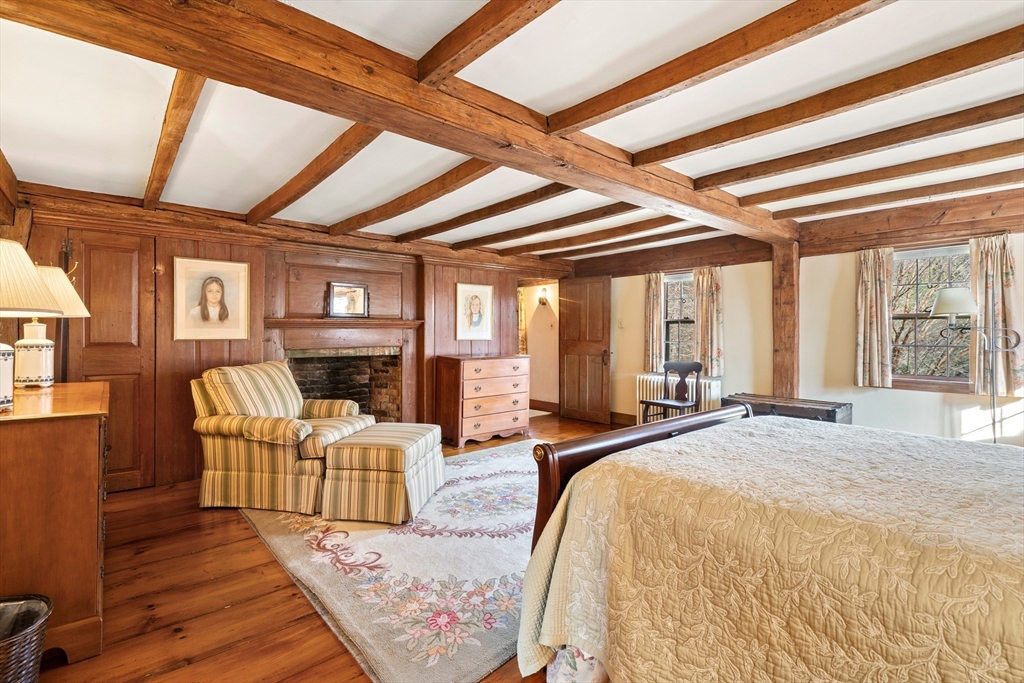 34 Miles River Road Hamilton, MA 01982 - Photo 35 of 42 a large bedroom with wooden floor and furniture