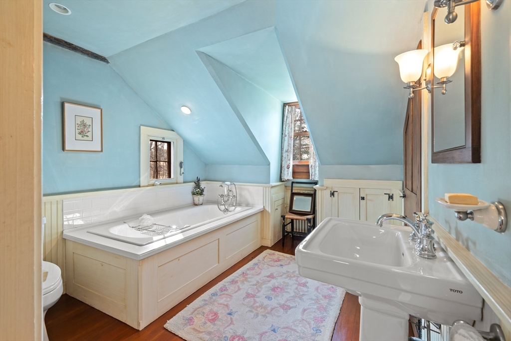 34 Miles River Road Hamilton, MA 01982 - Photo 36 of 42 a bathroom with a tub sink and mirror