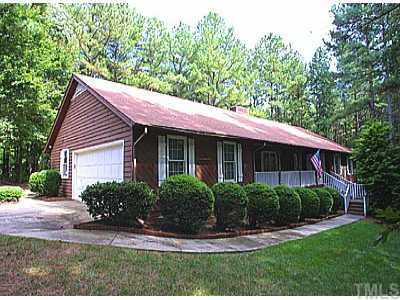 9900 Waterview Road Raleigh, NC 27615 - Photo 1 of 1 a front view of a house with a yard and potted plants