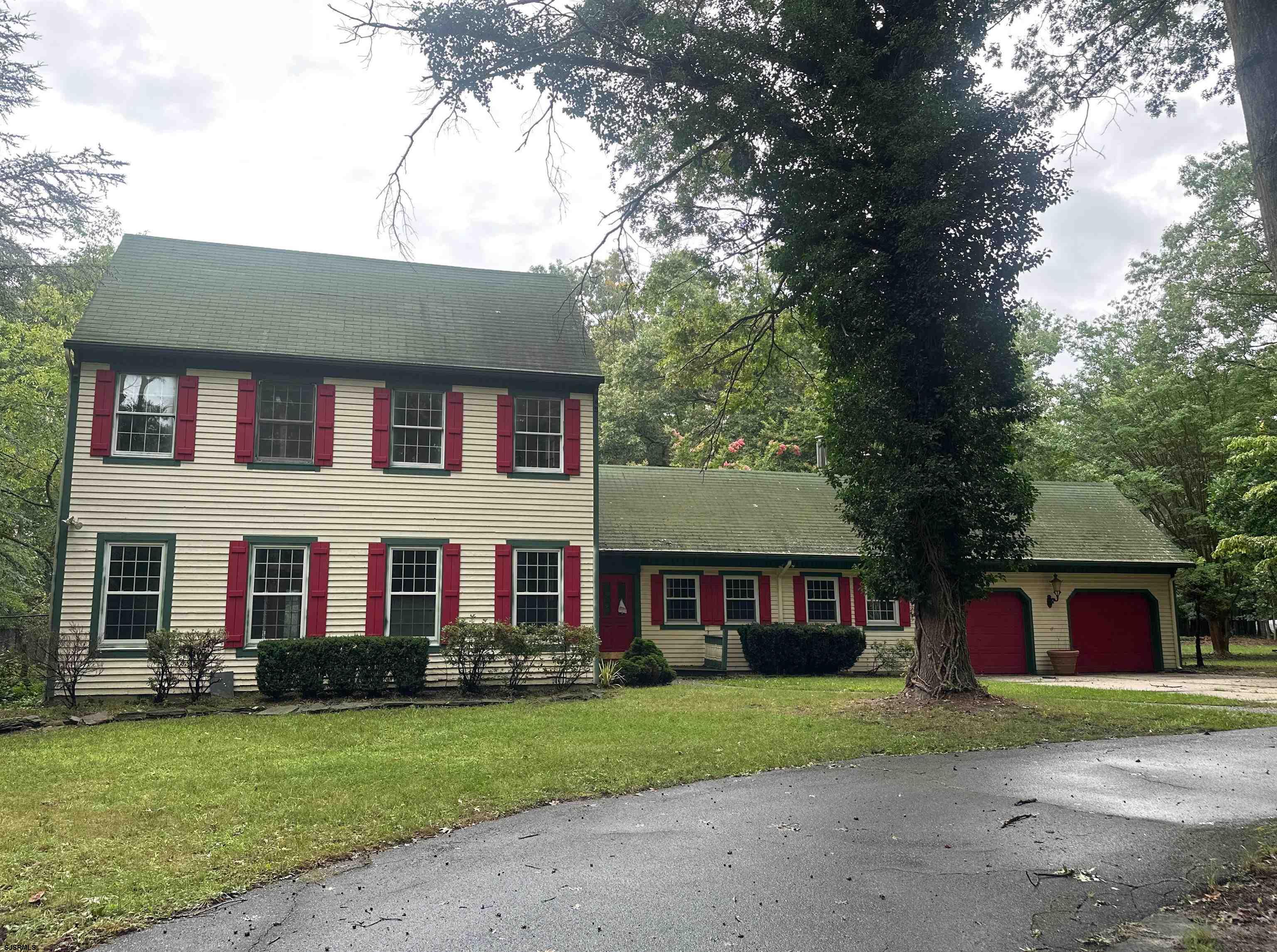 255 Cologne Port Road Port Republic, NJ 08241 - Photo 1 of 1 a front view of a house with a yard and garage