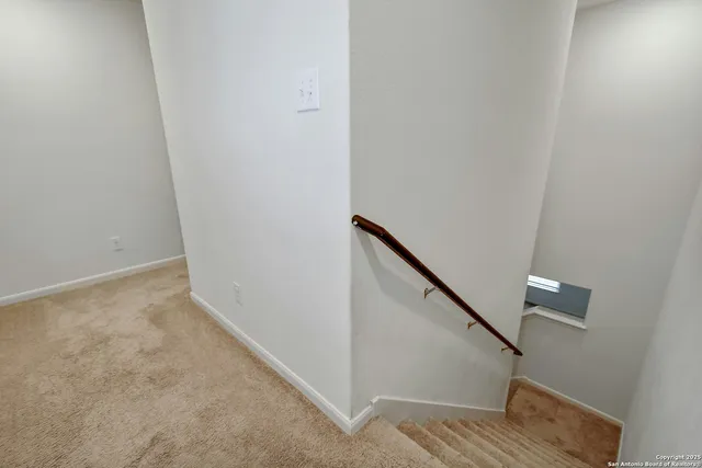 a view of hallway with stairs