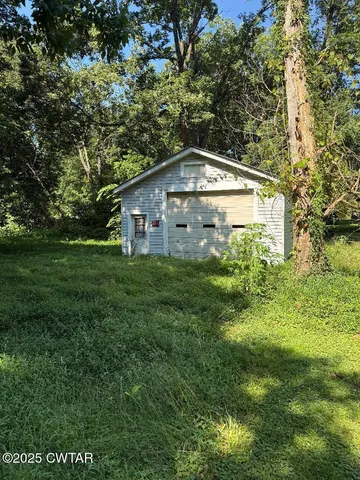 a house with a tree in front of it