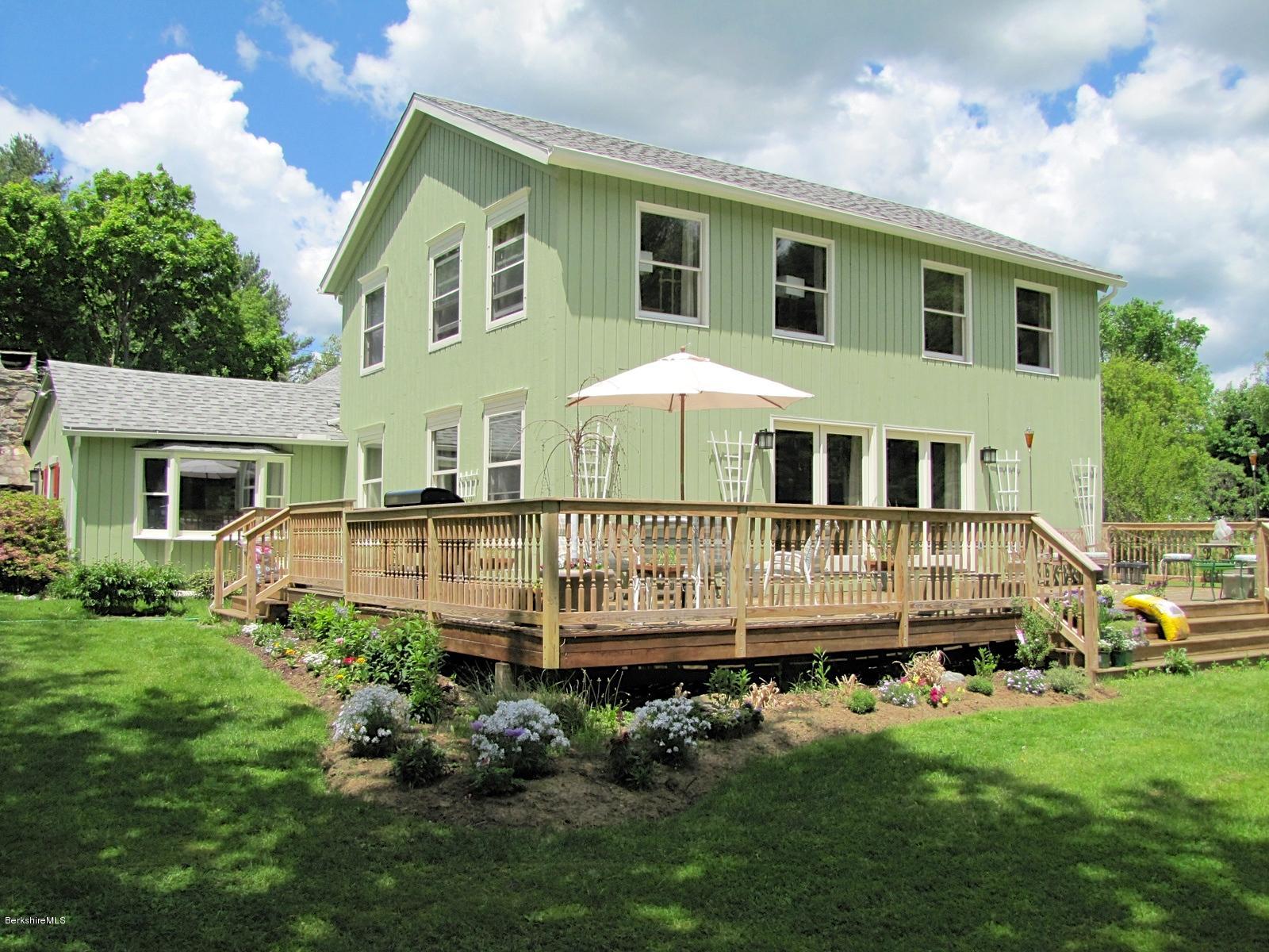 59 Salisbury Road Sheffield, MA 01257 - Photo 2 of 45 a front view of a house with a garden and deck