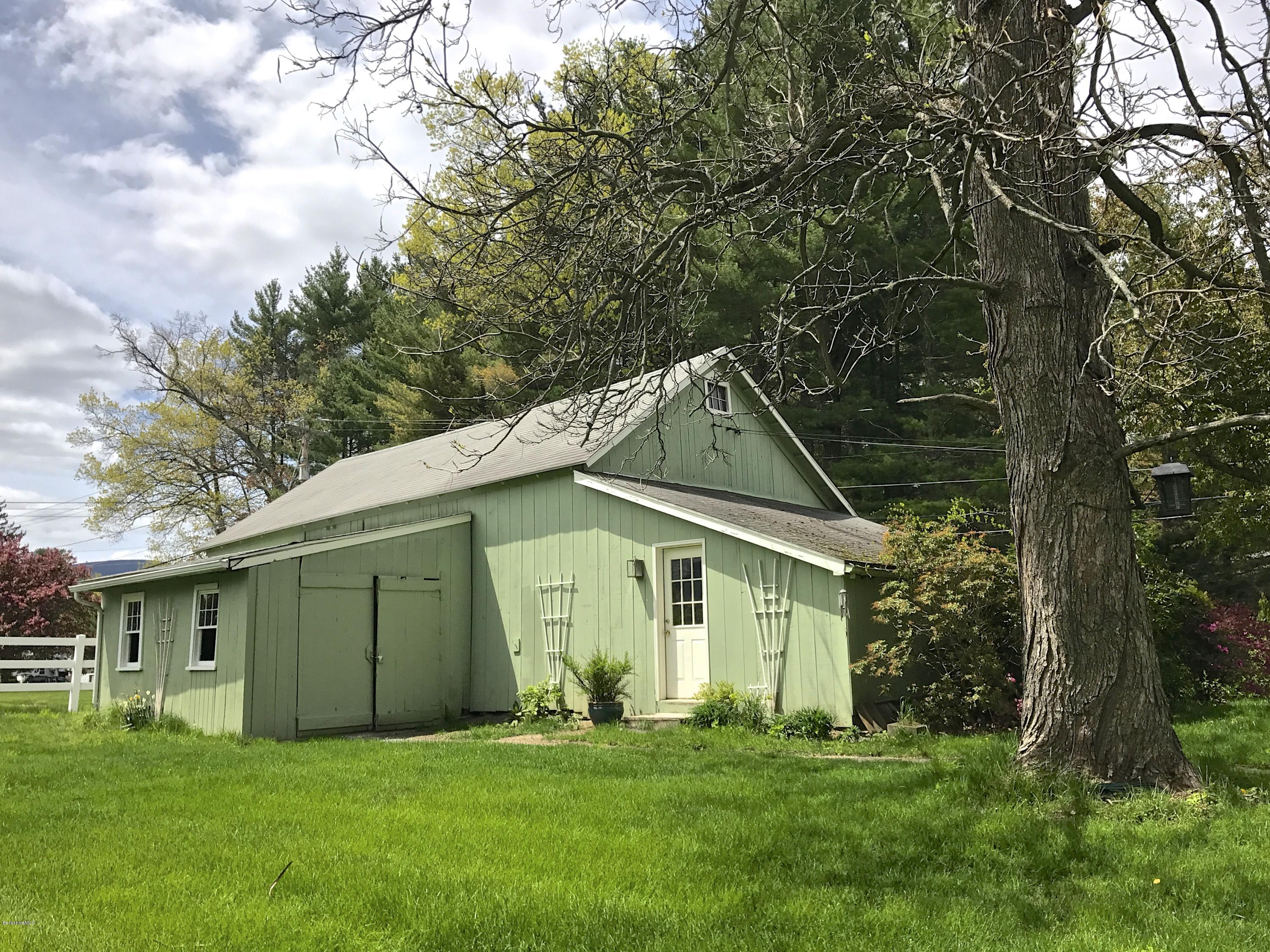 59 Salisbury Road Sheffield, MA 01257 - Photo 15 of 45 a front view of a house with a yard and garage
