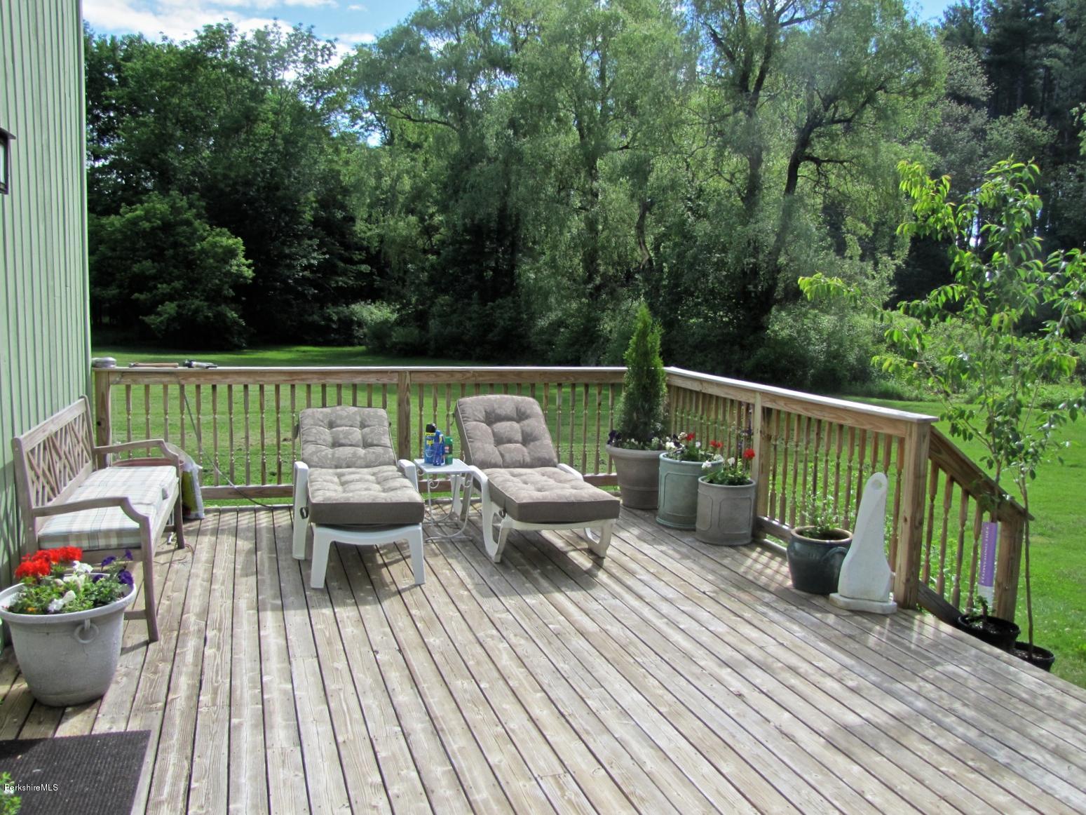 59 Salisbury Road Sheffield, MA 01257 - Photo 7 of 45 a view of a deck with couches wooden floor and outdoor space