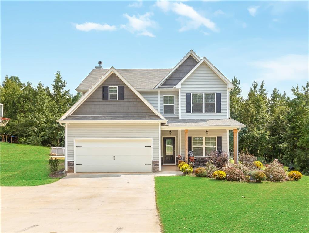 889 Proctor Road Rockmart, GA 30153 - Photo 1 of 1 a front view of a house with a yard and garage
