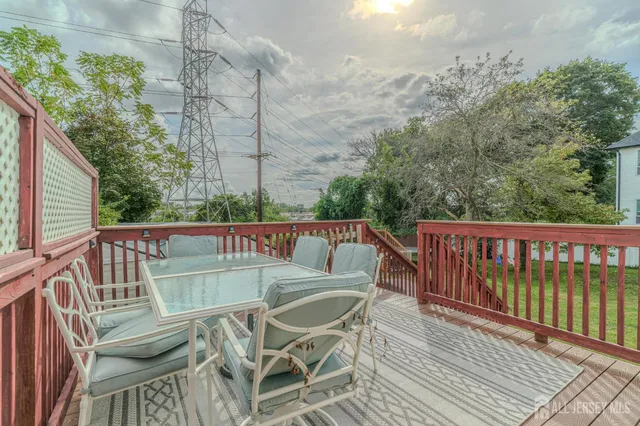 a view of a balcony with wooden floor