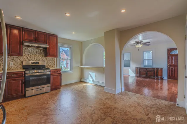a view of a kitchen with a sink and a stove top oven
