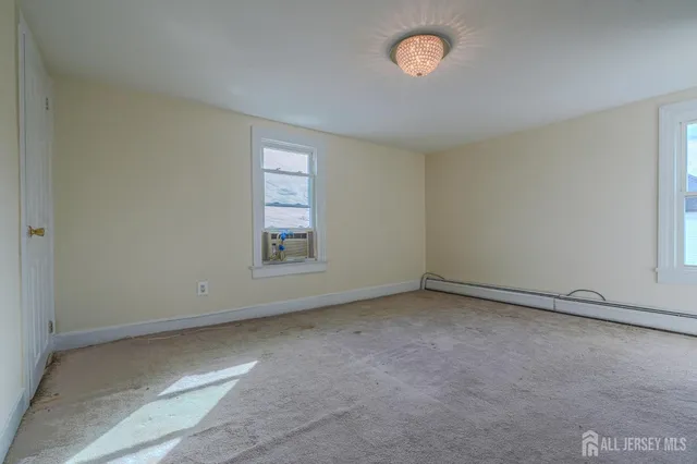 an empty room with a empty space and a window