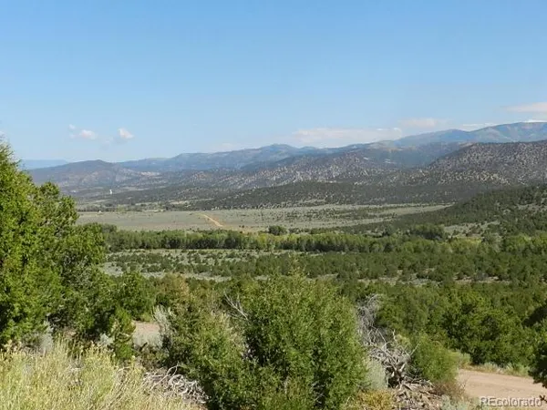 a view of a town with mountains in the background
