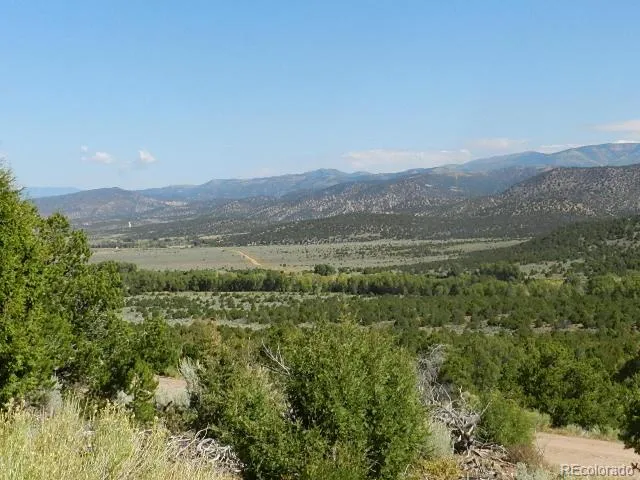 a view of a town with mountains in the background