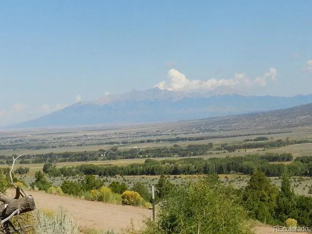 a view of a lake in middle of forest