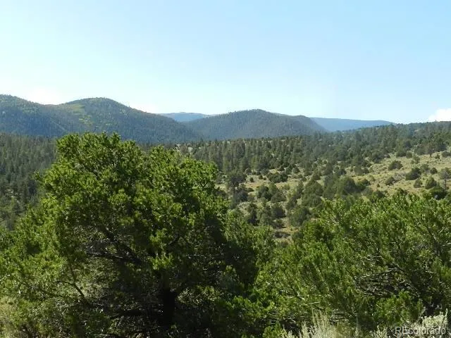 a view of a large body of water with a mountain in the background