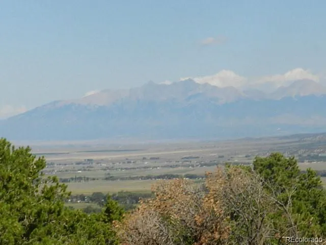 a view of an ocean beach and mountain