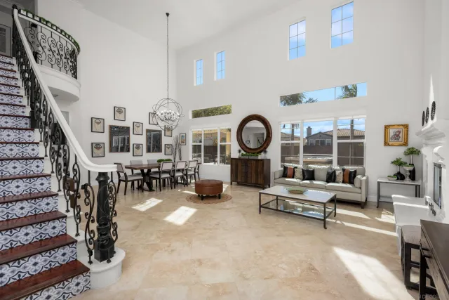 a living room with furniture and a clock