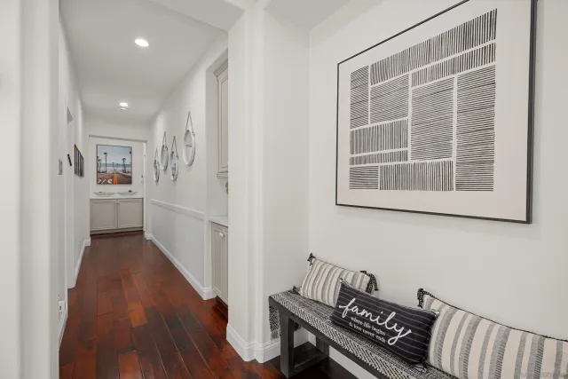 a view of a room with wooden floor and windows