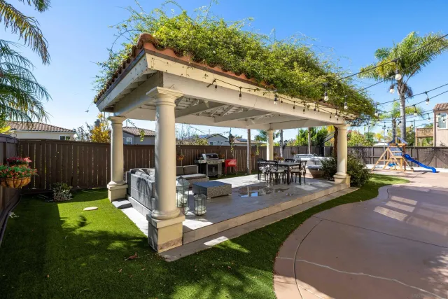 a view of a backyard with sitting area
