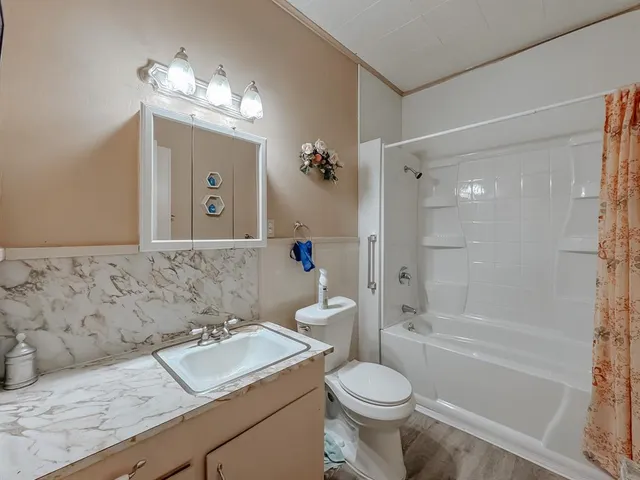 a bedroom with bed and window