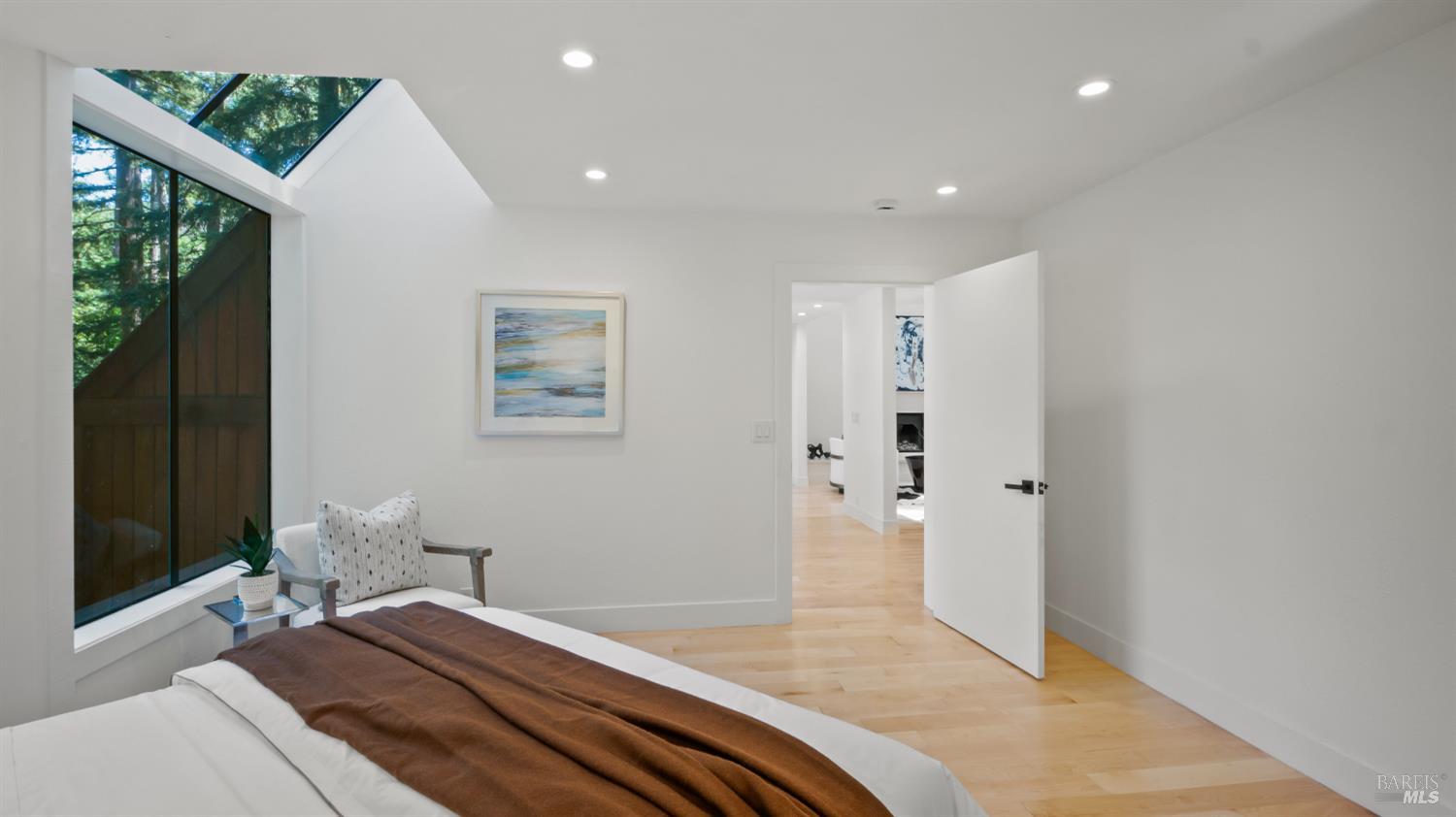 580 Ralston Avenue Mill Valley, CA 94941 - Photo 18 of 50 a bedroom with a bed and a chandelier