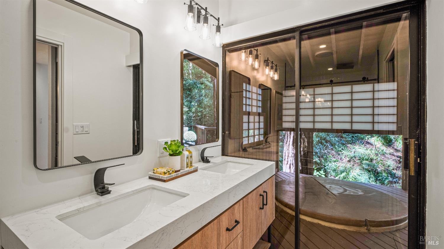 580 Ralston Avenue Mill Valley, CA 94941 - Photo 29 of 50 a bathroom with a sink and a large mirror next to a window